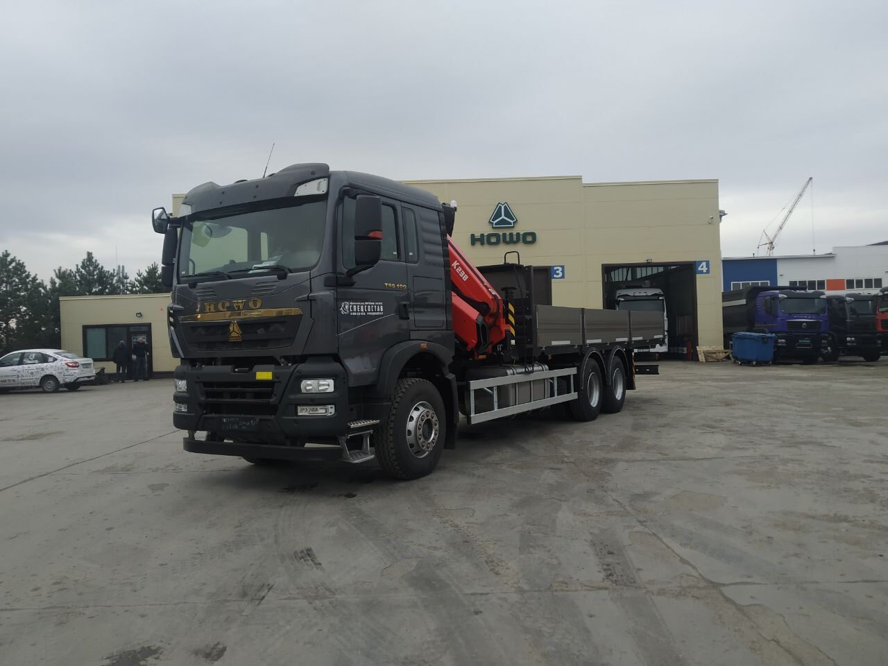 Бортовой автомобиль Howo T5G 6х4 с КМУ Sunhunk K238